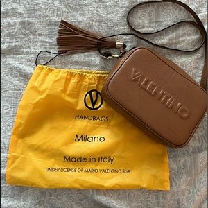 Mario Valentino Crossbody with extra gold chain extenders.